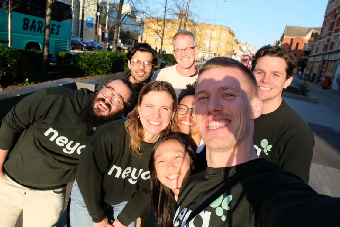 The Neya team together outdoors